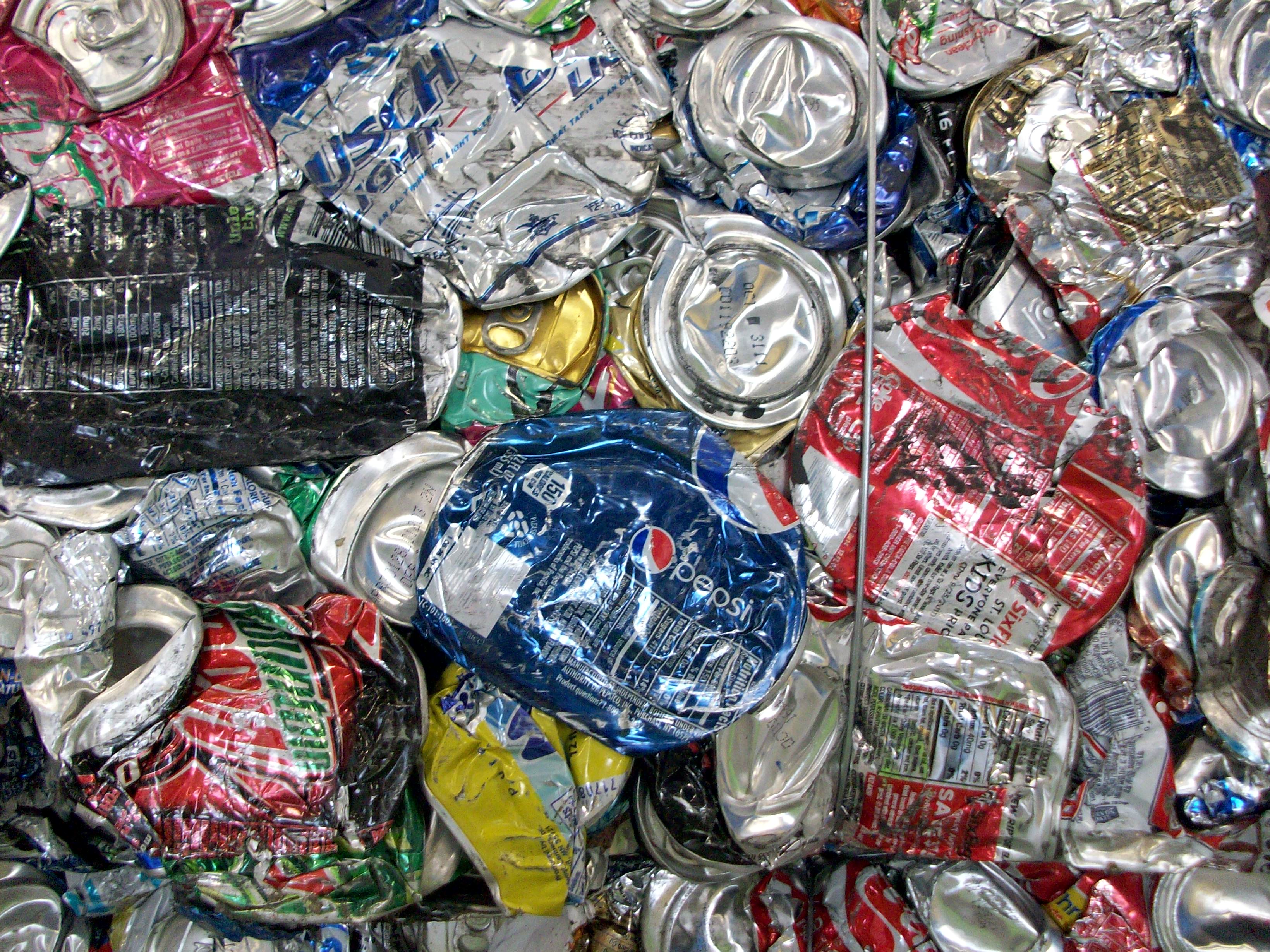 Crushed aluminum soda cans ready for recycling.