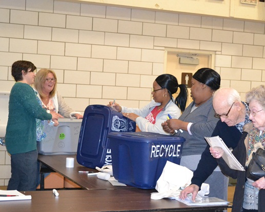Community members making recycling bins at an Ecology Action Center event.