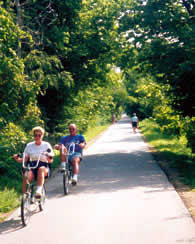 Two people riding bikes on the Constitution Trail.