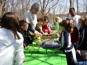 Michelle Covi, former EAC Director, hosting a workshop for kids to teach them about the environment.