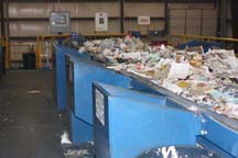 Occasionally, objects other than paper remain in the flow of paper waste. These objects are removed manually and sorted into separate storage bunkers.
